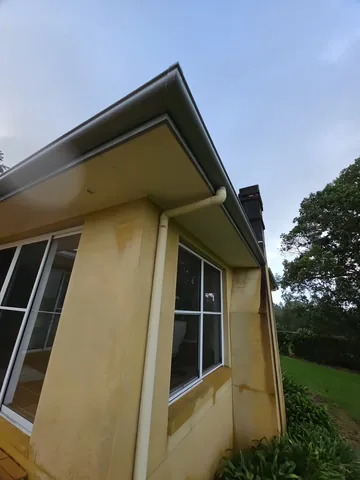 Fascia board and eave on a rendered gable end
