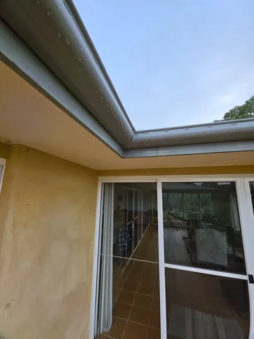 New guttering above a sliding door on a rendered home